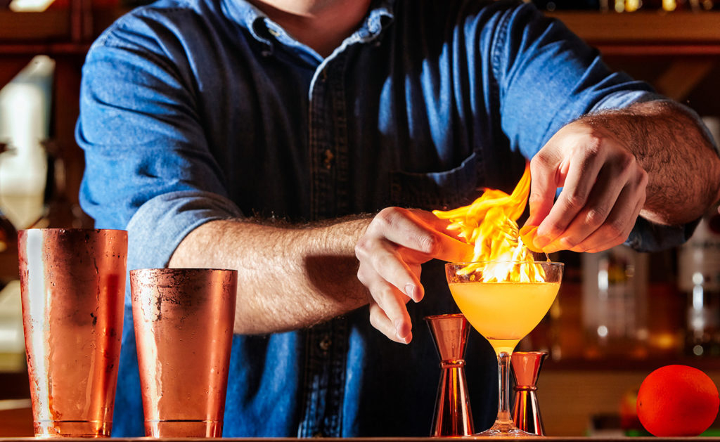 Everyday Kitchen brand positioning and brand identity case study — restaurant branding. Man making a fire cocktail. 