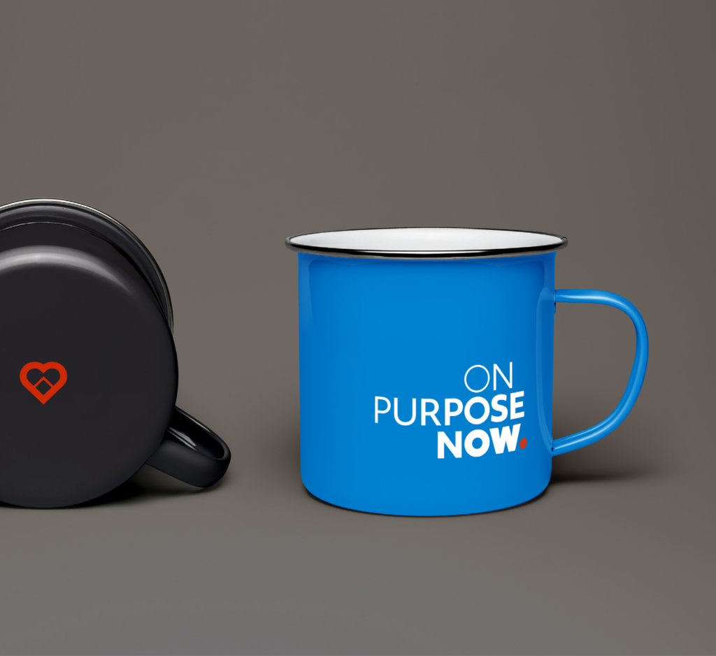 On Purpose Now Brand Identity displayed on blue mug with red icon on black mug.
