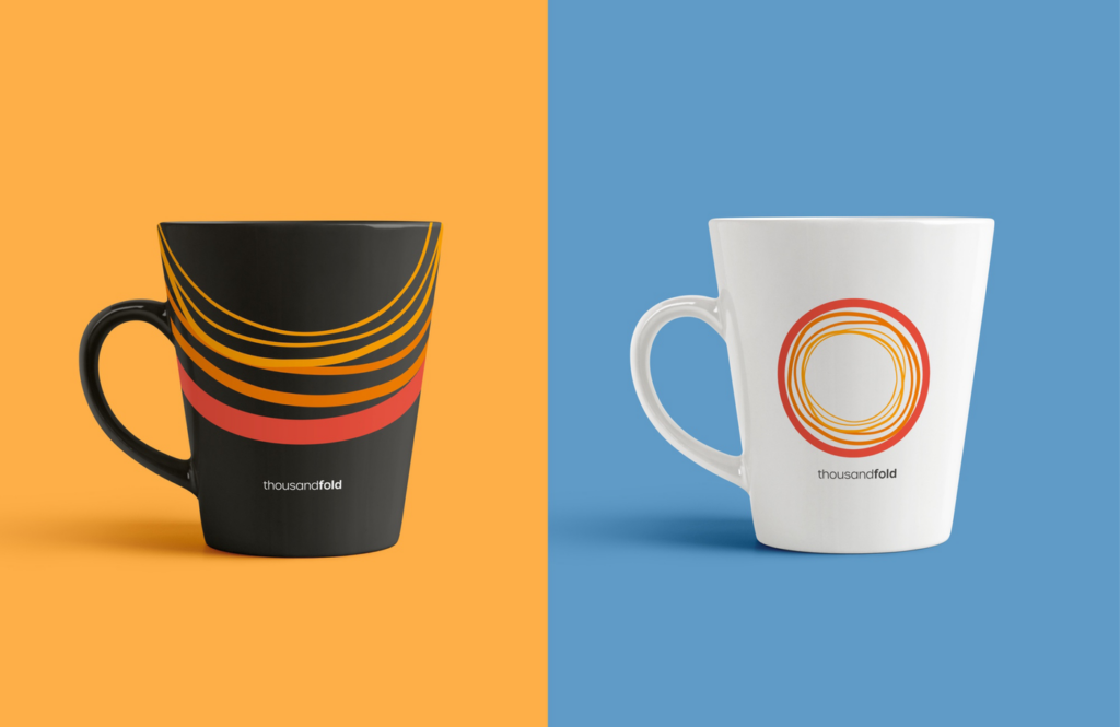 Thousandfold brand identity featured on a white and black coffee mug.